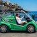A Guest in an electric tour vehicle next to a harbor in Funchal, Portugal